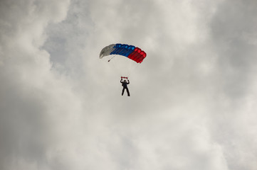 man with parachute in the sky