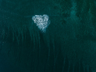 heart shaped wave breaking in the ocean