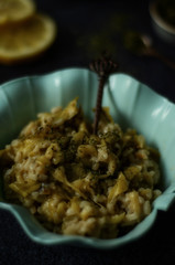 Green salad with pumpkin, dill and rice on rustic background