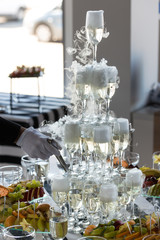 Wedding slide champagne for bride and groom indoors.