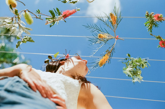 Woman + flowers on the clothesline