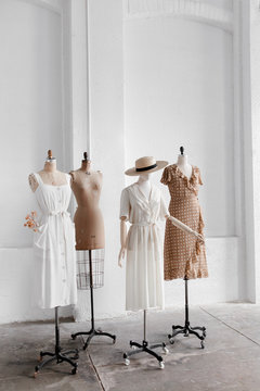 Display of vintage clothing on antique mannequins