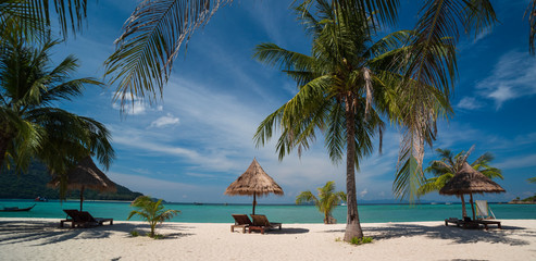 Turquoise sea and boats on tropical beach