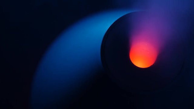 working a humidifier with a red circular light in the middle