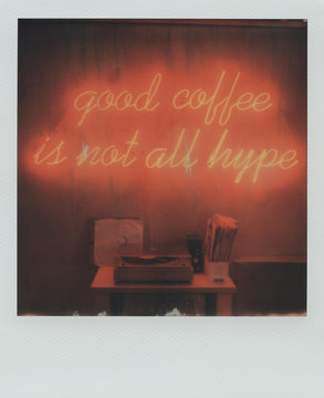 Polaroid with vinyl records and glowing inscription