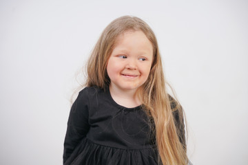 cute baby girl with long hair on white background in Studio