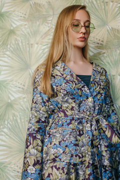 Young woman in glasses looking away
