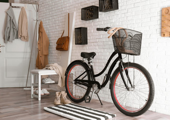 Fototapeta na wymiar Stylish hallway interior with modern bicycle. Hipster design