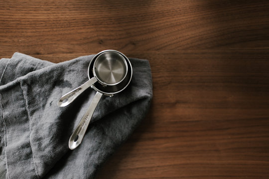 Set of measuring cups on linens