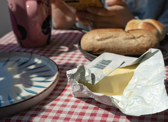 toasted bread placed in black plate,isolated on red patterned napkin