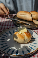 toasted bread placed in black plate,isolated on red patterned napkin