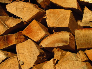 Fuel wood, logs aligned to the border, natural photo texture, close-up