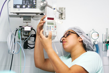 Technician setting up medical equipment