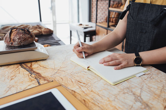 A Woman Working at Bakery Shop