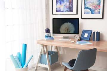 Modern workplace interior with computer on table