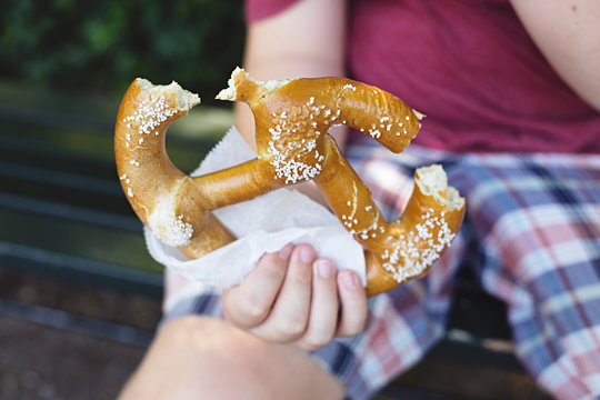 Playing tourist in Central Park NYC eating a pretzel