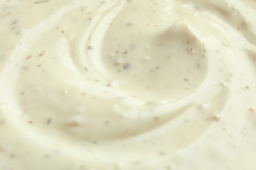Tasty homemade garlic sauce as background, closeup