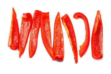 cut slices of red sweet bell pepper isolated on white background top view