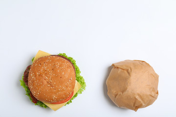 Fresh burgers on white background, top view