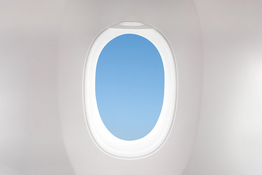 Isolated airplane window from customer seat view