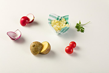 Ingredients, potatoes, onions, parsley, tomatoes, radish