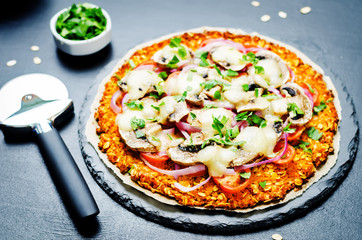 Sweet potato pizza crust with tomato, red onion and mushrooms
