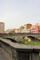 Fototapeta na wymiar View of the bridge channel in Girona, Spain.