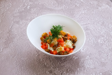 Vegetarian salad with mushrooms, cabbage, tomato and croutons