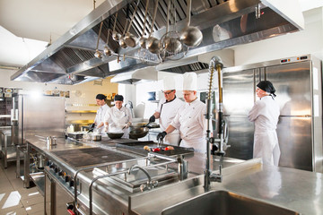 cook making dinner in the kitchen of high-end restaurant.