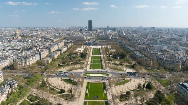 View of cityscape of Paris, France with major attractions of Paris - Champ de Mars, Tour Montparnasse, Hotel National des Invalides - tilt up.