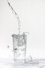 water flows into a transparent glass