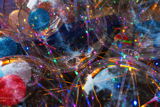 Multi-colored luminous led bulbs. Colorful background of glowing balls. Led balls for holidays. Festival of led decorations. The concept of energy-saving and cold lighting. Selective focus.