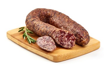 Smoked salami sausage on a cutting board, dried meat, close-up, isolated on white background