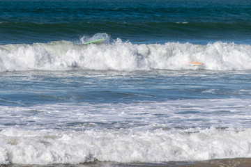 Fototapeta premium Surfboard wipeout in Atlantic Ocean waves, Morocco