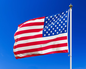 US flag on the blue sky, isolated with clipping path.