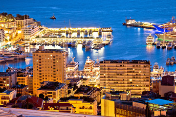 Fototapeta na wymiar Monte Carlo yachting harbor and colorful waterfront evening view
