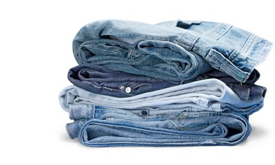 Stack of jeans isolated on white background