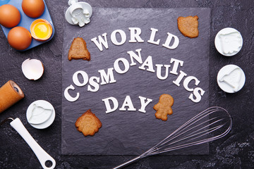 Text is World Cosmonautics day and cookies in form of astronaut, rocket, flying saucer and alien.