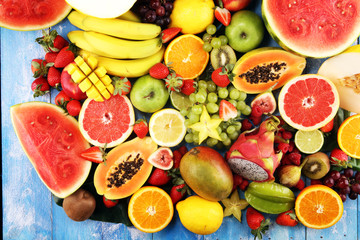 Tropical fruits background, many colorful ripe fresh tropical fruits