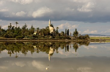 Fototapeta premium Landscape of Hala Sultan Tekke mosque in Cyprus with cloudy sky