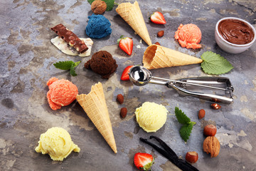 Set of ice cream scoops of different colors and flavours with berries and fruits