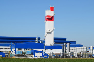 Fire tower at the plant for the processing of scrap metal. Huge factory old metal refiner
