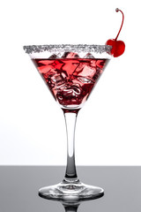 Cocktail with ice and cherry