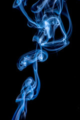 White and blue smoke isolated on a black background