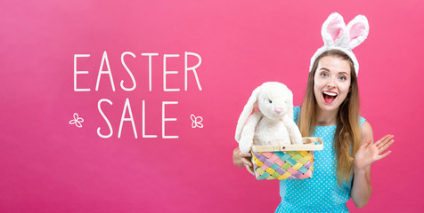 Easter sale message with young woman with Easter basket
