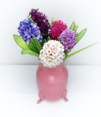 Hello Spring - Colored Hyaciths in a pink cute vase.