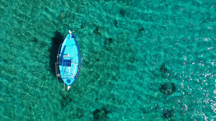 Aerial drone bird's eye view photo of traditional docked fishing boats near Naousa in island of...