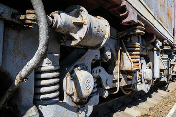 Old rusty wheels of the locomotive  and the elements of the drive