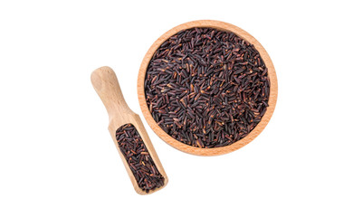 jasmine black rice in wooden bowl and scoop isolated on white background. nutrition. bio. natural food ingredient.