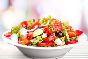 Photo of fresh salad with vegetables